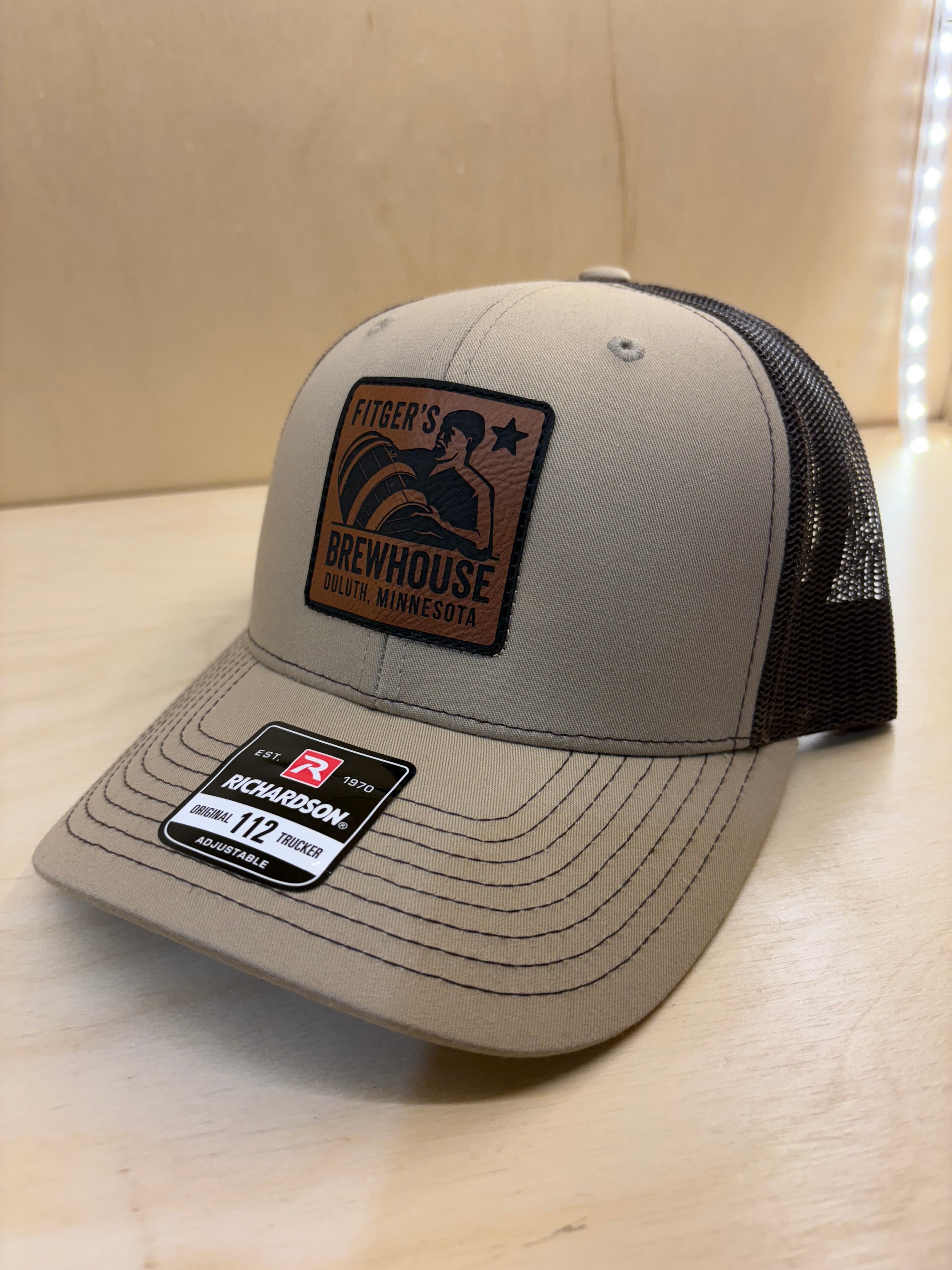 New Trucker Hat with leather kegman patch on front